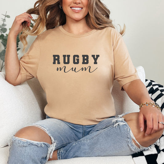 Cute and sand coloured, the "Rugby Mum" text stands out on this sand-coloured t-shirt, embodying dedication to the rugby sidelines.