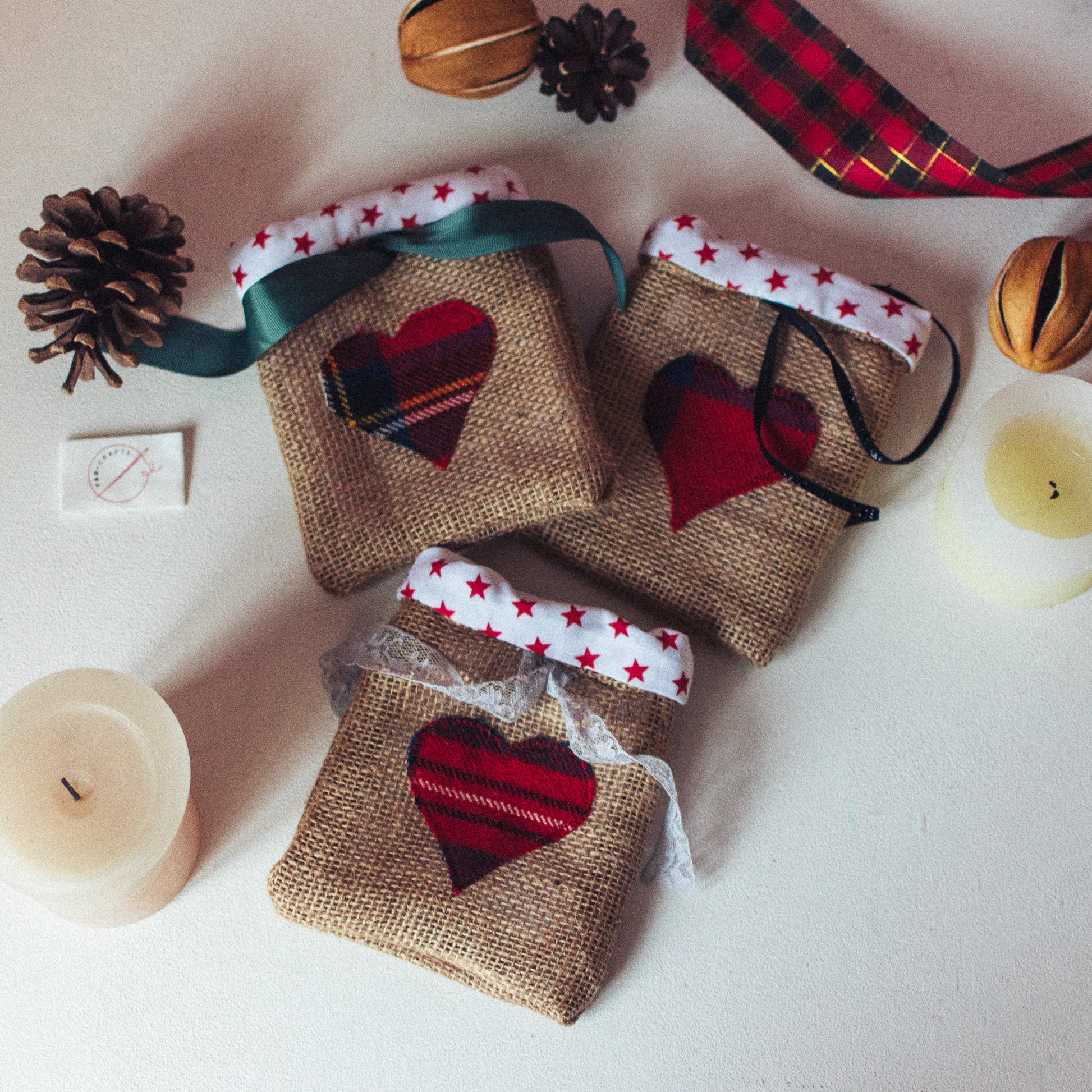 Small Tartan Heart Santa Bags measuring 16cm x 14cm, adorned with charming love hearts on the front, adding a touch of love and tradition to your holiday gifting.