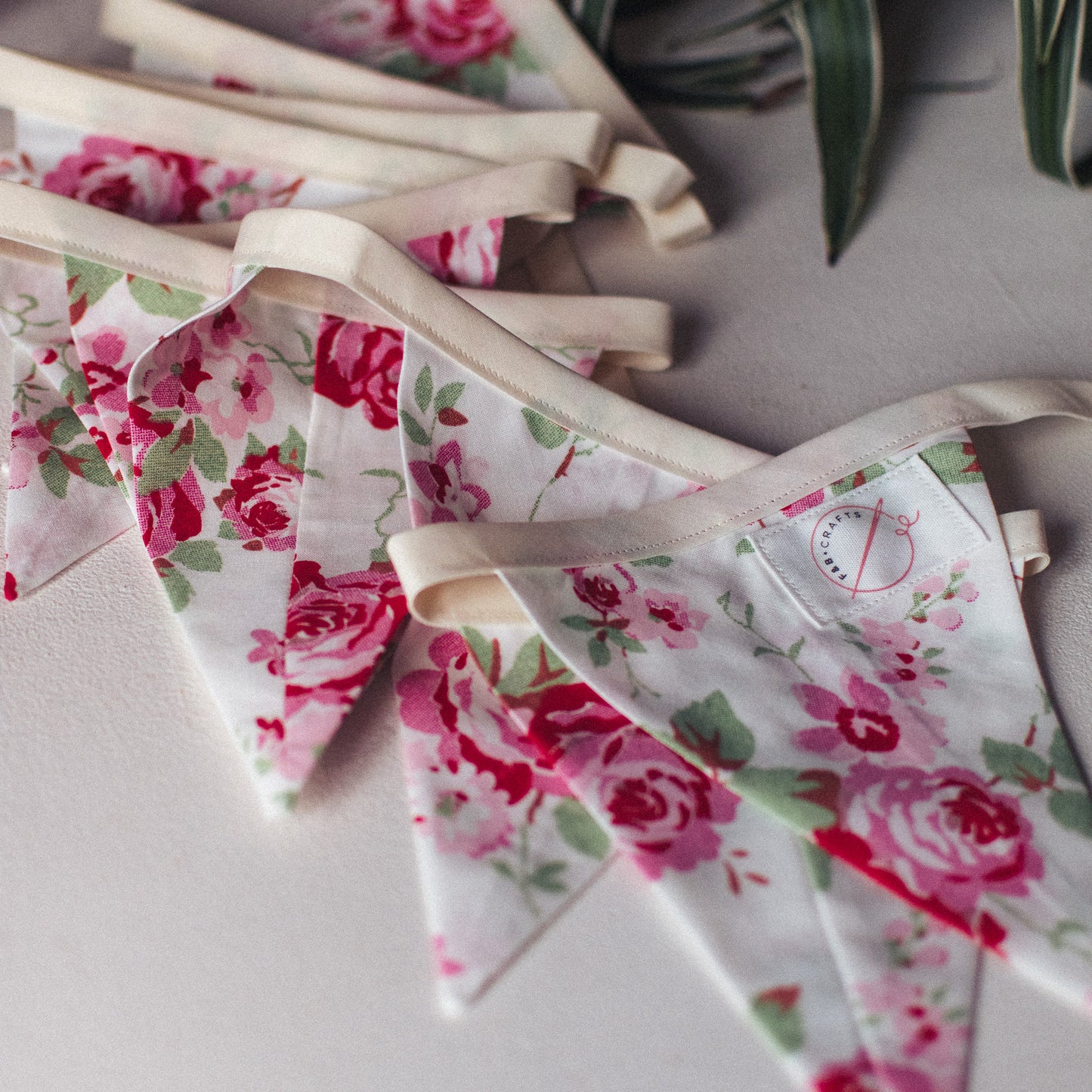 Close-up of Rosali Vintage Style Cath Kidston Bunting, showcasing intricate pink rose details on the fabric segments