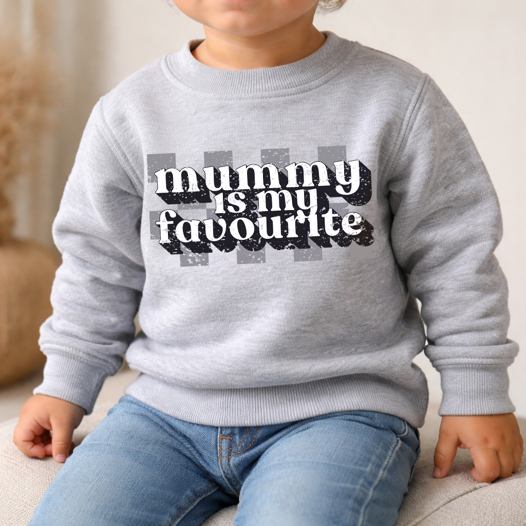 Child wearing a gray sweatshirt with 'mummy is my favourite' text.