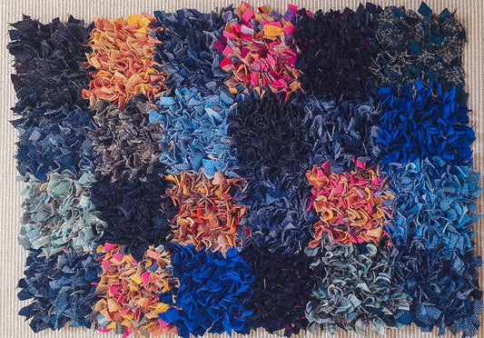 "Handmade Patchwork Rectangles Rag Rug - A 2ft x 3ft hessian and wool rug featuring an eclectic mix of colors, including blues, oranges, pinks, navy, and mint, in a captivating patchwork rectangles design