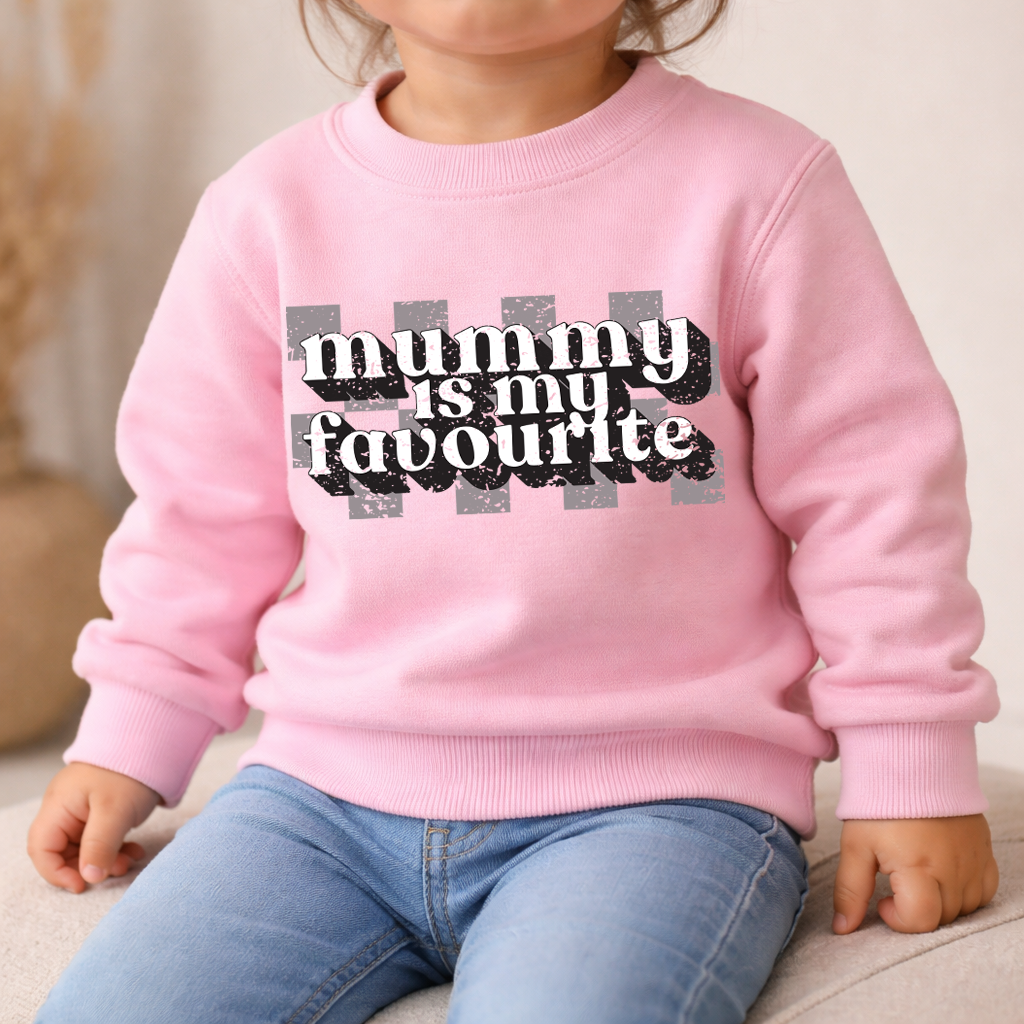 Child wearing a pink sweatshirt with 'mummy is my favourite' text.