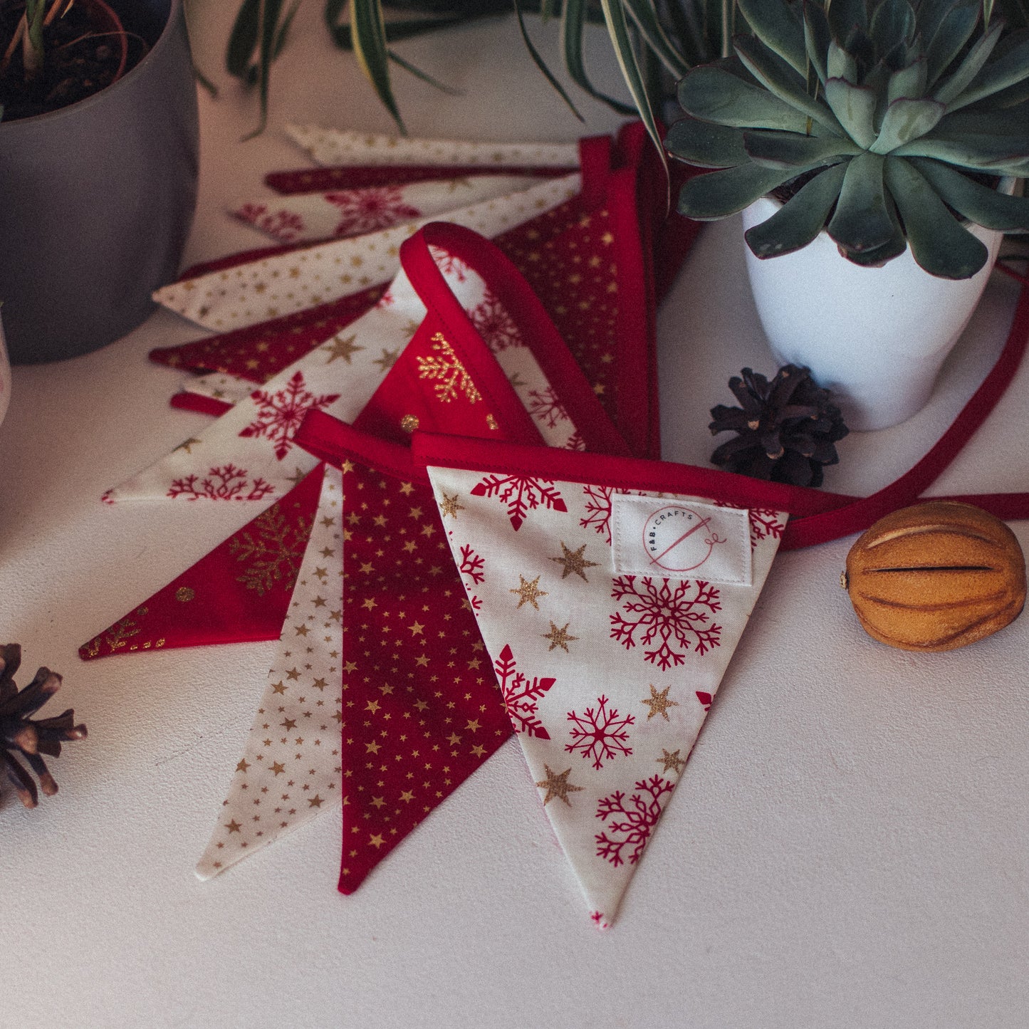 F&B Crafts red and Cream Festive Fabric with red and gold glitter snowflakes and stars 
